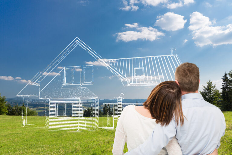 Loving young couple looking at dream house.